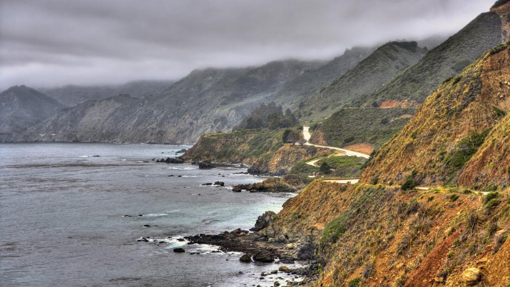 Serene Coastal Cliffs with Overcast Skies wallpaper