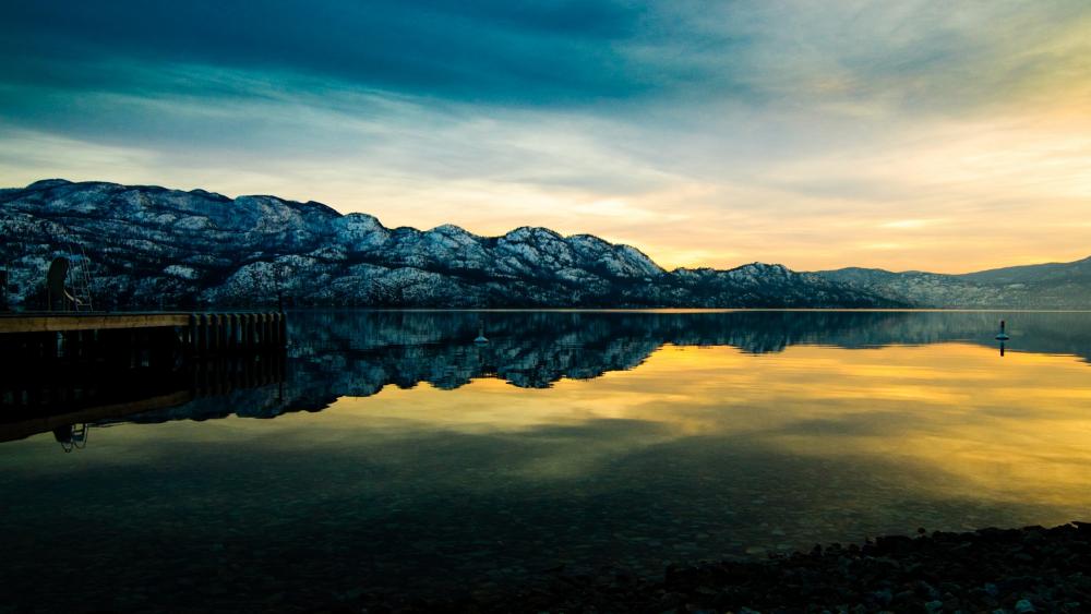 Serene Sunset Reflections Over Tranquil Waters wallpaper