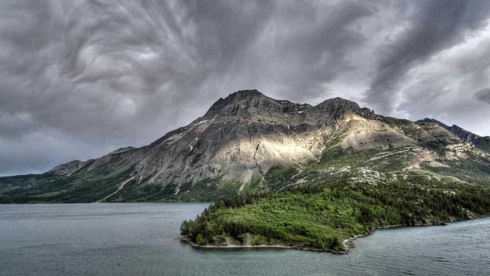 Majestic Mountains Under Dramatic Skies wallpaper