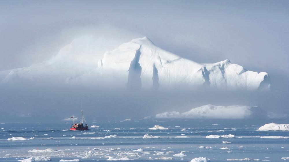Majestic Iceberg in Tranquil Waters wallpaper