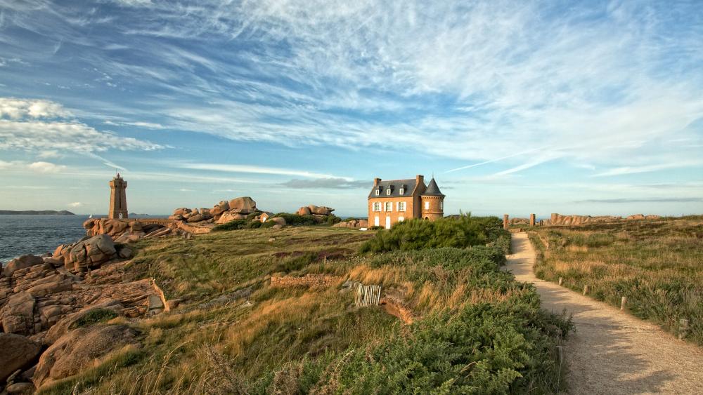 Seaside Serenity with Lighthouse and Cottage wallpaper