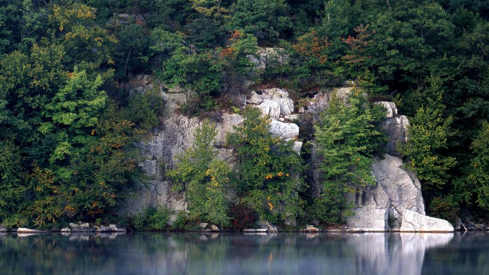 Majestic Cliffs Reflected in Tranquil Waters wallpaper