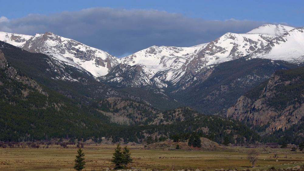 Majestic Snow-Capped Mountains in a Serene Valley wallpaper