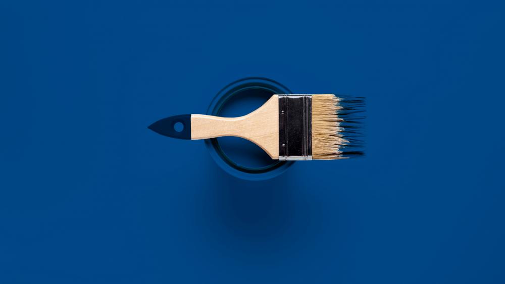 top view of brush and paint can wallpaper
