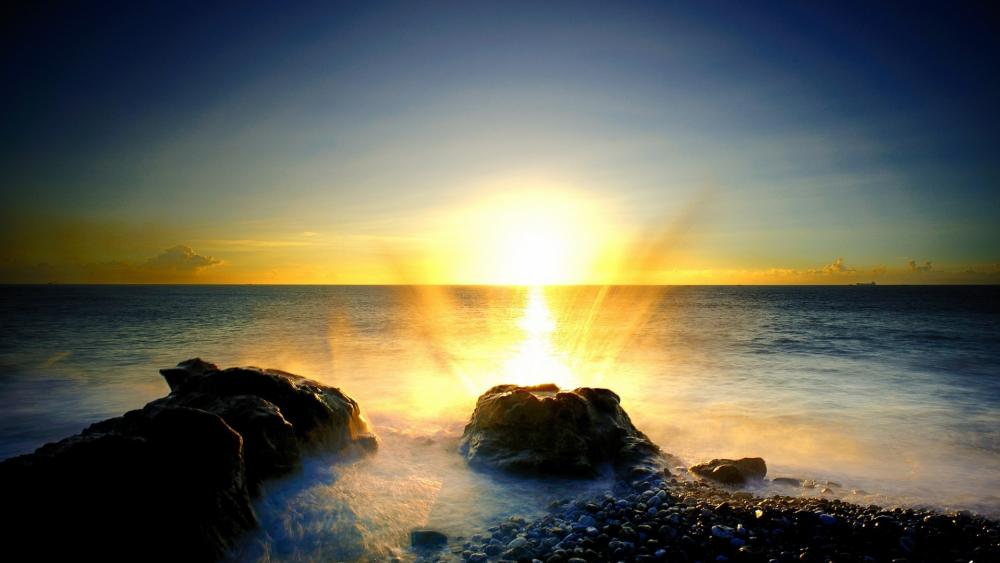 Golden Sunrise Over Gentle Waves wallpaper