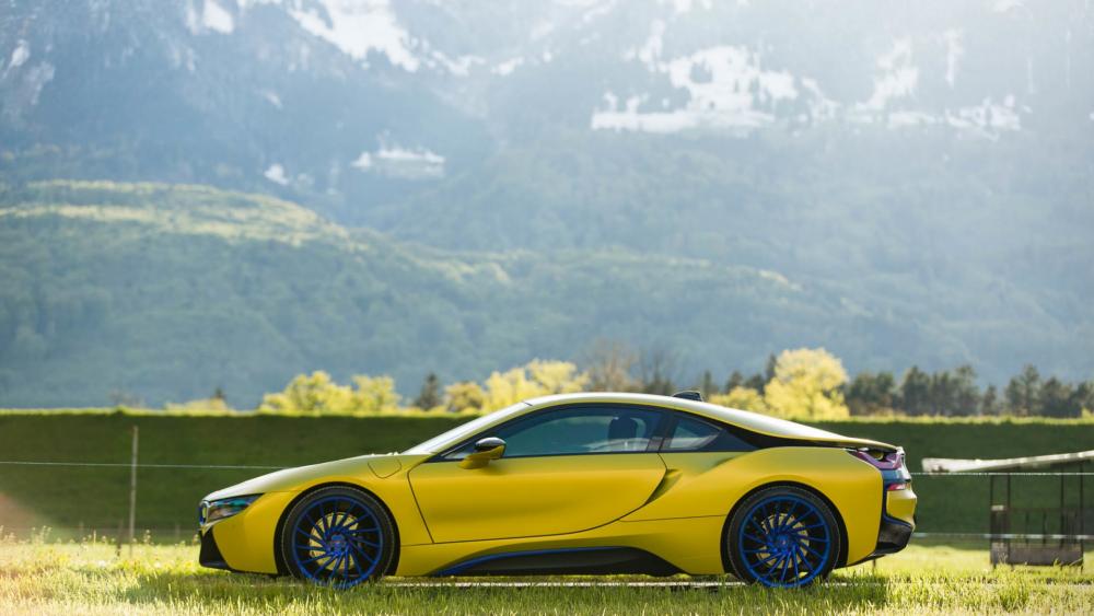 Vibrant Yellow Sports Car in Nature's Embrace wallpaper