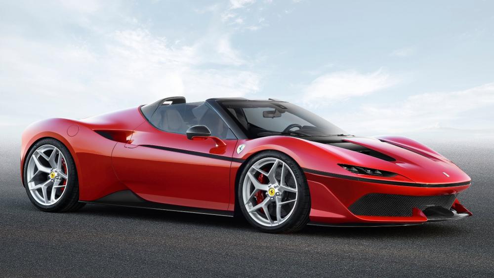 Sleek Red Convertible Racing into the Horizon wallpaper