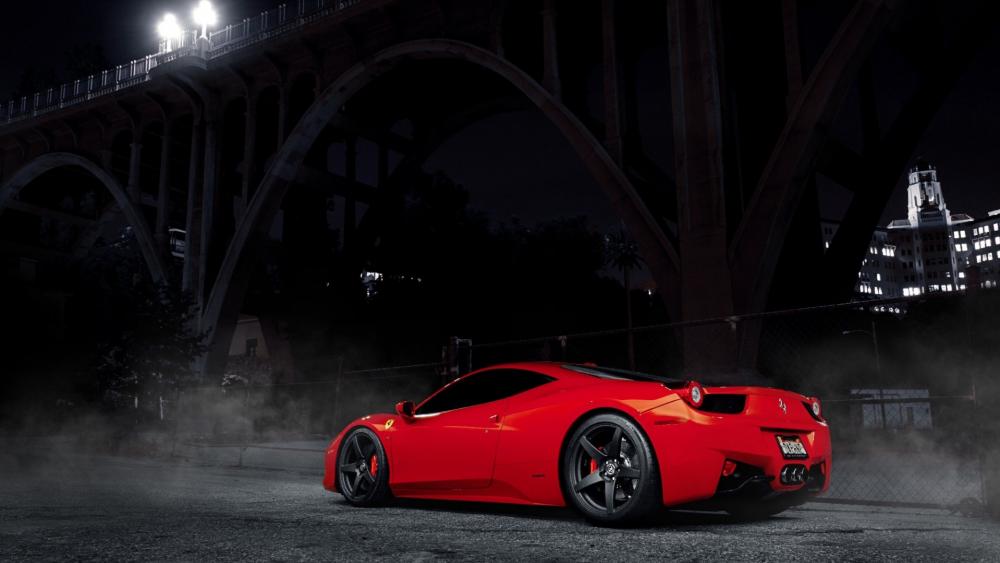 Sleek Red Supercar Under Urban Night Lights wallpaper