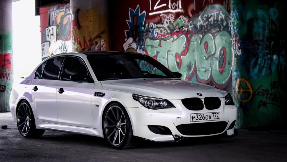 Sleek BMW in Urban Graffiti Setting wallpaper