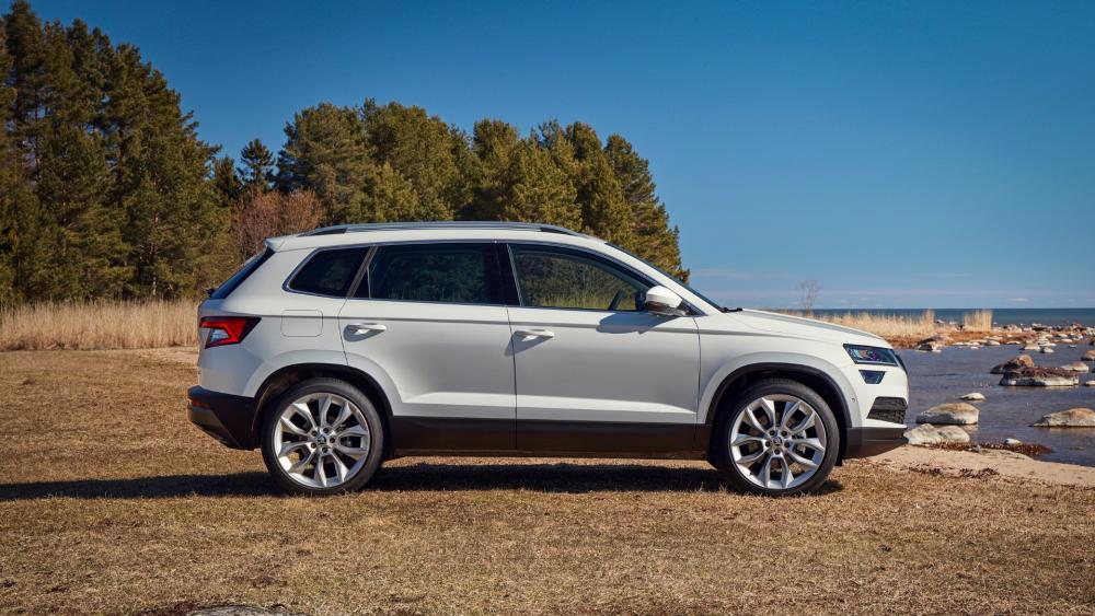 Sleek SUV Against Serene Nature Landscape wallpaper