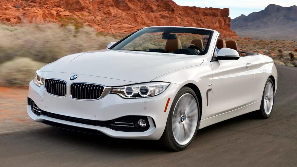 Sleek White Convertible BMW on Open Road wallpaper
