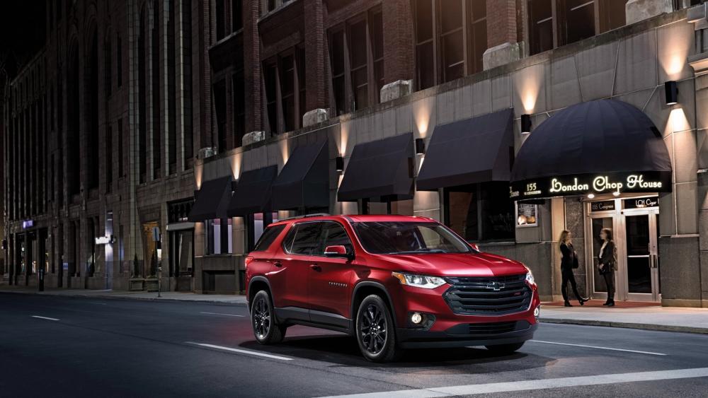 Sleek Red SUV in Urban Setting wallpaper