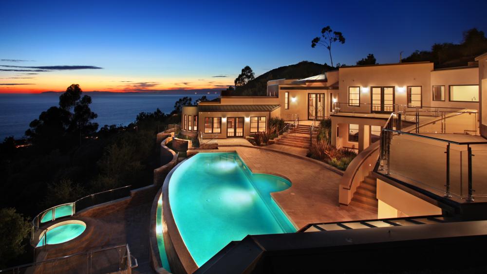 Stunning Luxurious Home with Pool at Twilight wallpaper
