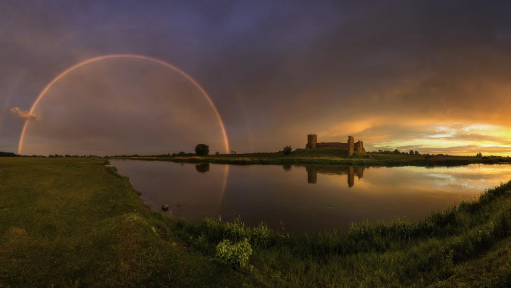 Majestic Rainbow Over Scenic Castle Landscape wallpaper