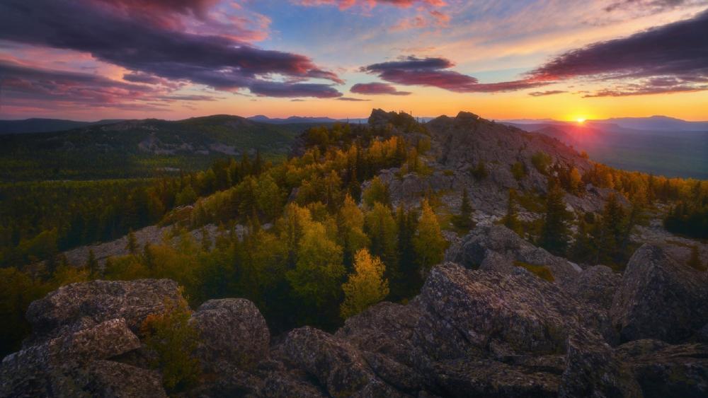 Majestic Mountain Sunset Over Vibrant Forests wallpaper