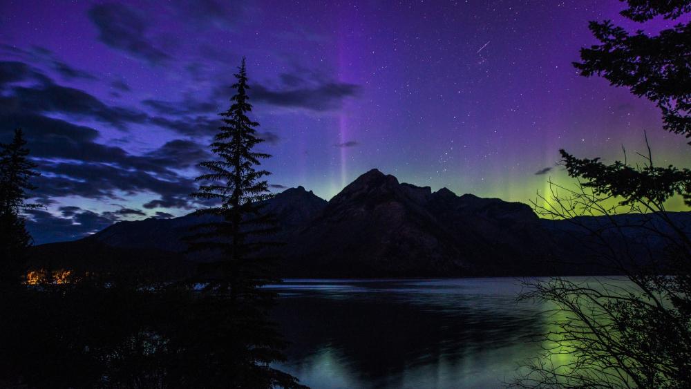 Majestic Aurora Over Serene Mountain Lake wallpaper