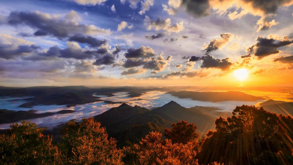 Serene Sunrise Over Majestic Mountains wallpaper