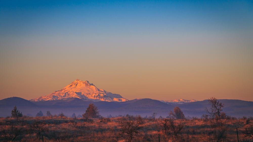 Majestic Mountain Sunrise Over Serene Landscape wallpaper