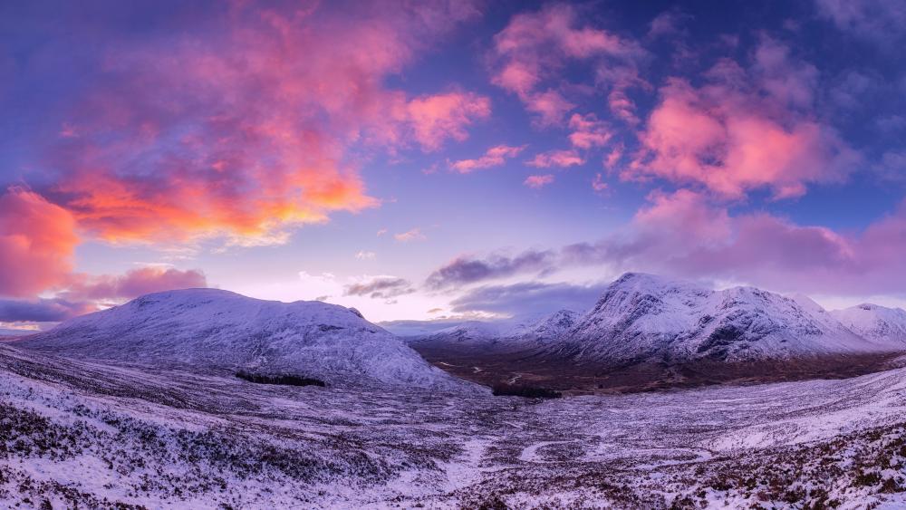 Pink clouds over the snowy mountains wallpaper