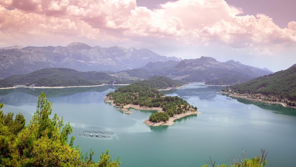 Serene Lake Landscape with Mountains and Islands wallpaper