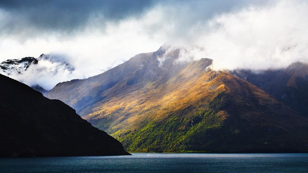 Majestic Mountain Landscape with Serene Waters wallpaper