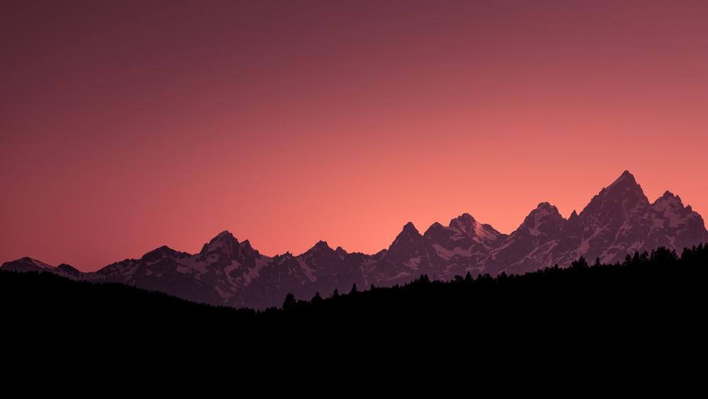 Sunset Silhouette Over Majestic Mountains wallpaper
