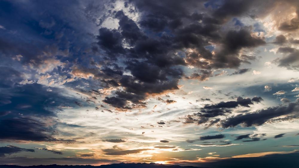 Vibrant Sunset Over Dynamic Cloudscape wallpaper