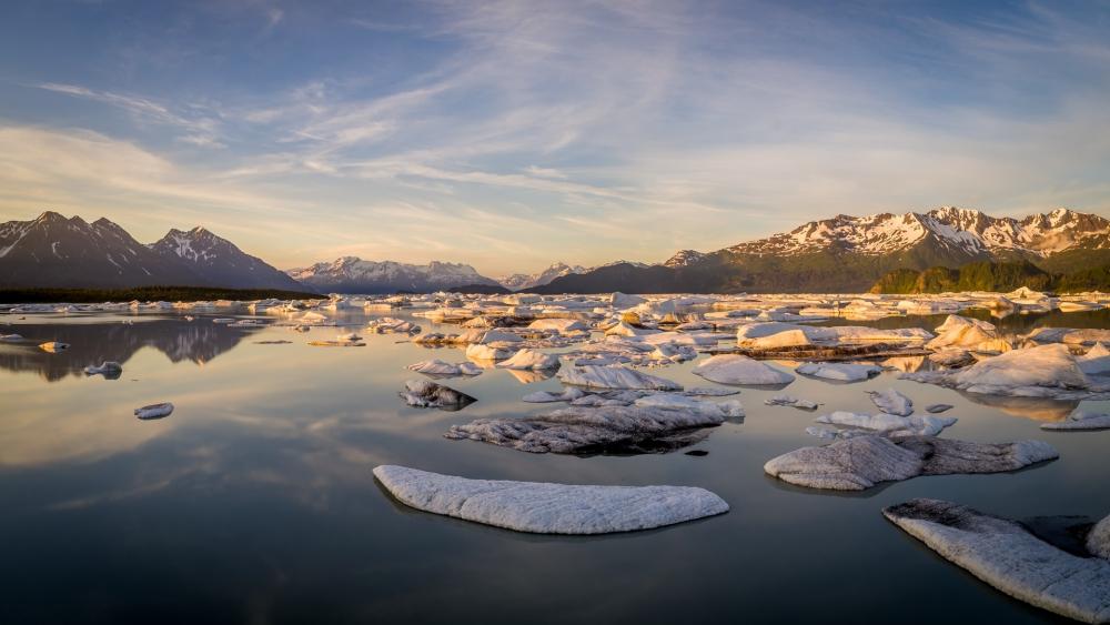 Serene Glacial Landscape Reflecting Mountains and Sky wallpaper
