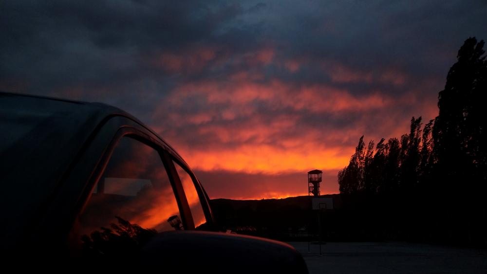 Stunning Sunset Reflection on a Car's Window in HD wallpaper