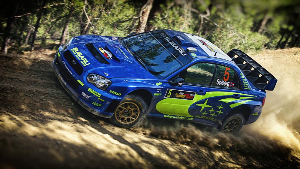 Subaru Rally Car Speeding Through the Dusty Trail wallpaper