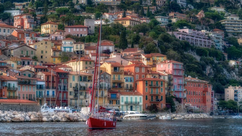 Red skiff at the coast of the Villefranche-sur-Mer, French Riviera wallpaper