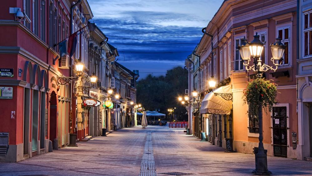 Charming Night Street in a Vibrant Cityscape wallpaper