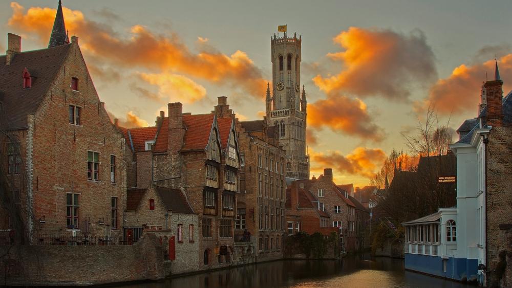 Charming Sunset Over Historic Canal City wallpaper