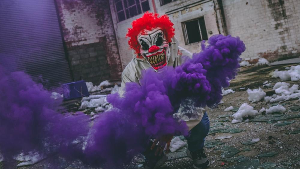 Mysterious Joker Clown amidst Purple Haze wallpaper