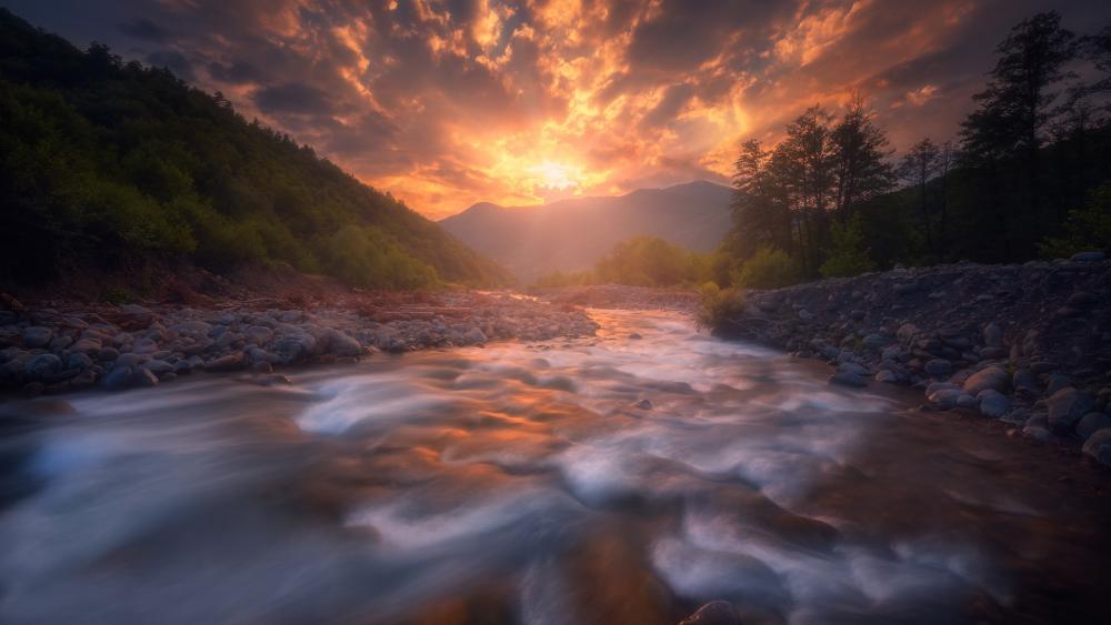 Sunset Radiance Over Flowing River wallpaper