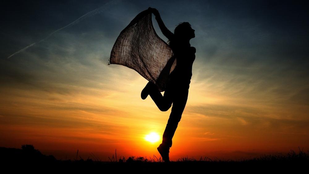 Dancing woman silhouette in the sunset wallpaper