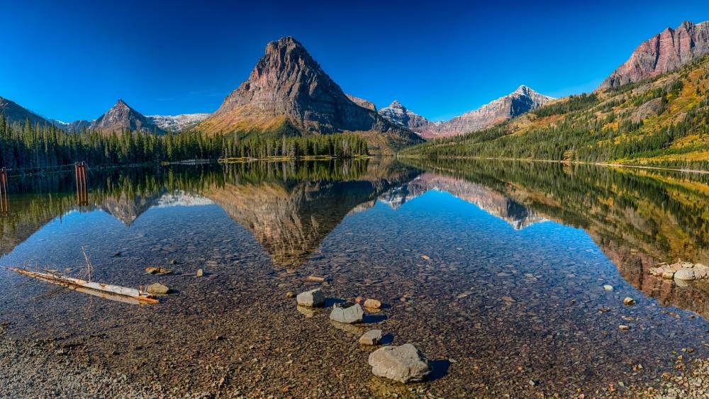 Sinopah Mountain reflected in the Two Medicine Lake wallpaper
