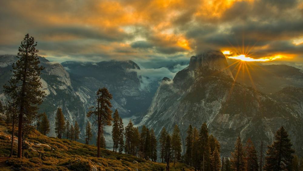 Half Dome in the clouds wallpaper