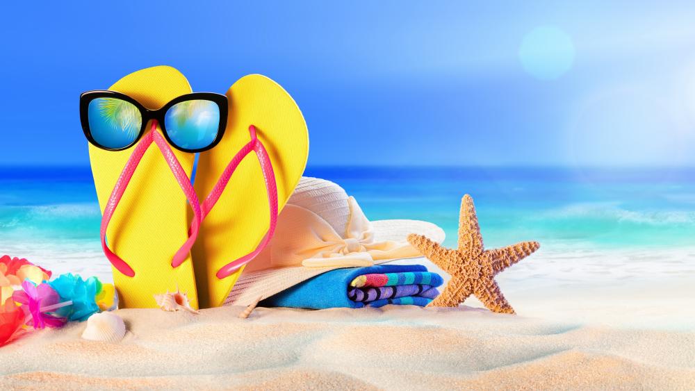 Flip flop with sunglasses on the beach wallpaper