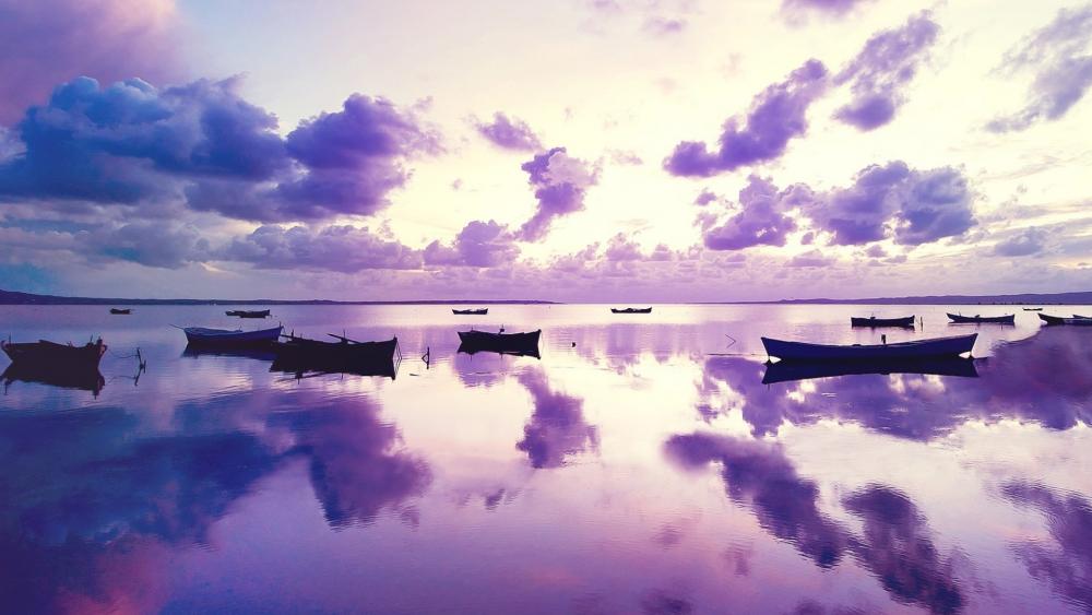 Purple sunset with boats wallpaper