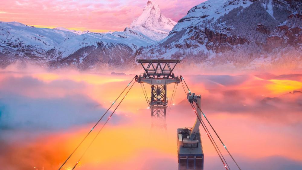 Cable car in mountains at sunset wallpaper