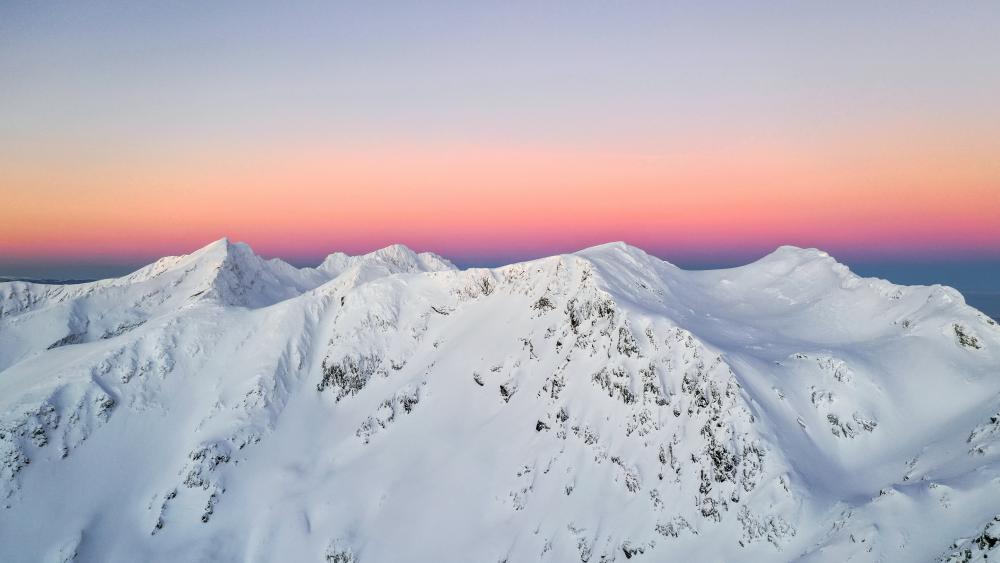 Purple pink sky and snow mountains wallpaper