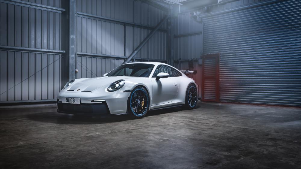Sleek Porsche 911 GT3 in Dramatic Garage Lighting wallpaper