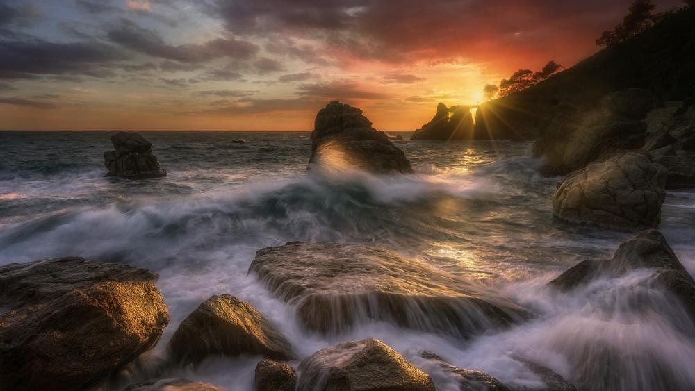 Sunset Waves and Rocky Shores wallpaper