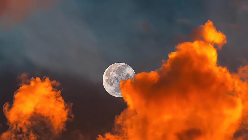 The moon behind clouds wallpaper