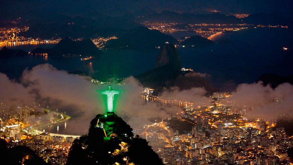 Christ the Redeemer statue and the night lights of Rio de Janeiro wallpaper