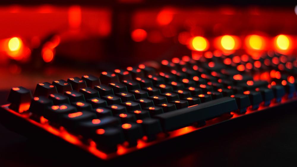 Illuminated Red Gaming Keyboard at Night wallpaper