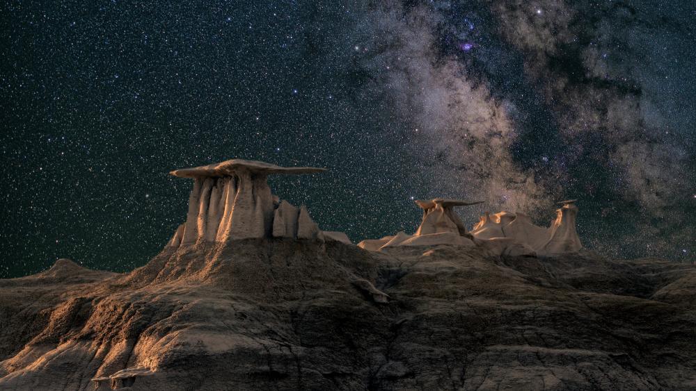 Starry Night Over Desert Formations wallpaper