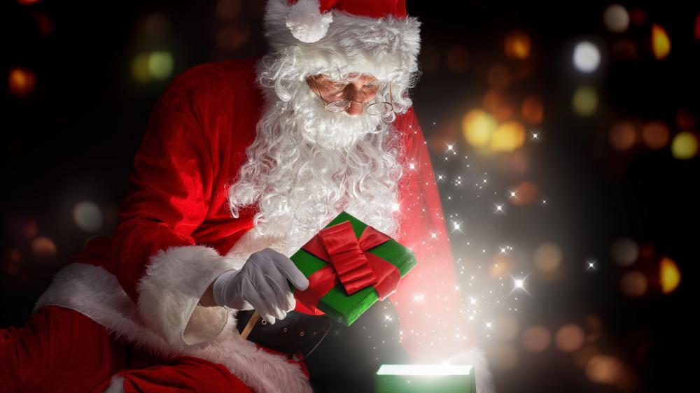 Santa Claus opening gift wallpaper