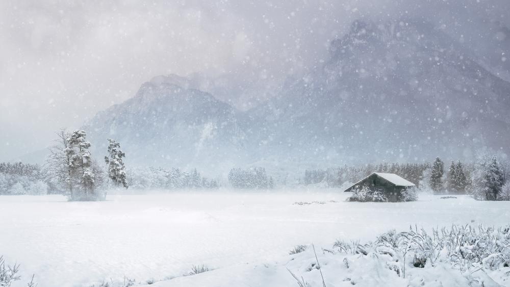 Snow covered hut in snowfall wallpaper